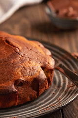 Homemade baking. Fragrant zebra cake with a crispy crust on a plate with coffee and chocolate
