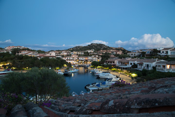 Fototapeta na wymiar Round harbor Sardinia in the evening