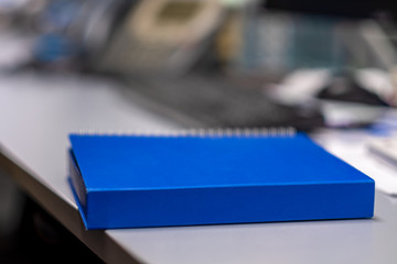Blue notebook For taking notes Placed on an office desk