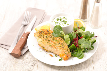 grilled chicken fillet with lettuce and sauce