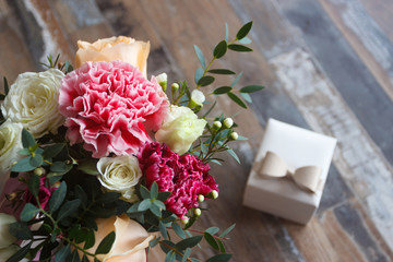 A present box and a bouquet of flowers