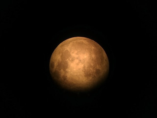 The moon is out of focus, view from reflecting telescope and seen in the Eastern Asian hermisphere Thailand. 
