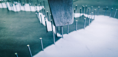 Nails and hammer used for string art.