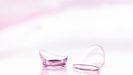 Tools for vision correction. Glasses and lenses with diopters on the background of splashes and...