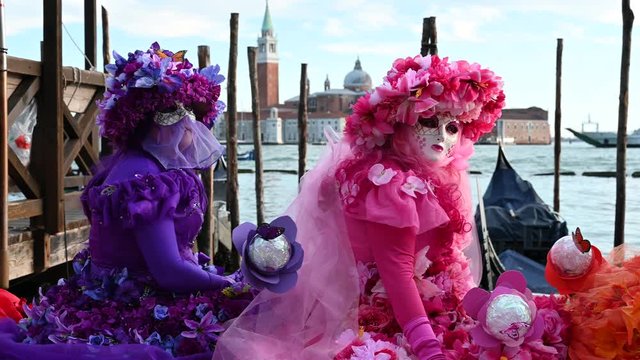 February 2020 Venice Carnival, Italy - Venice - carnival masks are photographed with tourists in Piazza San Marco