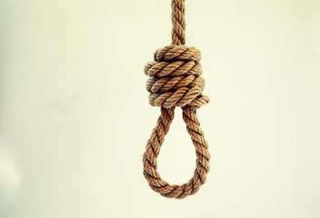 Braided thick rope tied in a skein. Hemp rope for decoration and design. Background from a fishing rope.