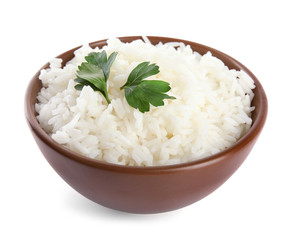 Bowl with cooked rice and parsley isolated on white