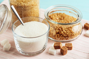 Various bowls with different sorts of sugar on table