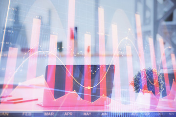 Forex Chart hologram on table with computer background. Double exposure. Concept of financial markets.