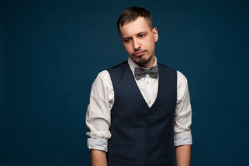Portrait of young man in formal clothes posing