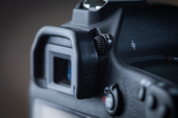 Close-up macro shot of viewfinder of the modern digital SLR camera. Ring of  diopter adjustment.