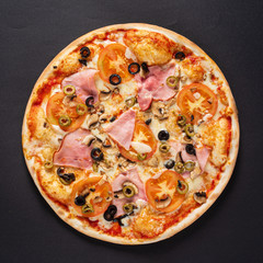 tasty pizza on the black background