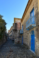 Acciaroli, Italy, 02/15/2020. A narrow street between the old houses of a village in southern Italy