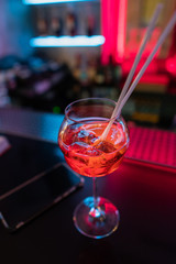  orange cocktail at the bar