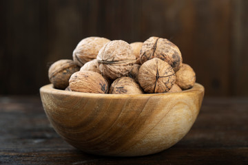 Walnut in a wooden bowl.