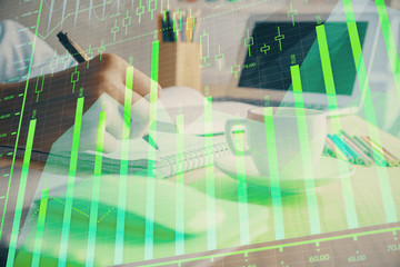 Financial chart drawn over hands taking notes background. Concept of research. Double exposure