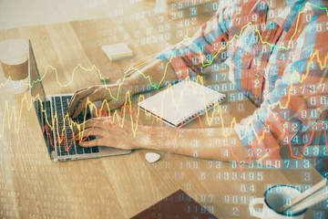 Multi exposure of forex graph with man working on computer on background. Concept of market analysis.