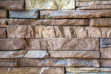 Natural Gray and brown stone brick background wall surface. Background with copy space