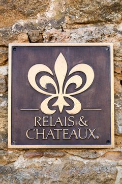Bagnols, France - February 25, 2017: Relais and Chateaux symbol on a wall. Relais and Chateaux is a global fellowship of individually owned and operated luxury hotels and restaurants