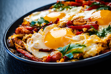 Shakshuka - fried eggs with vegetables