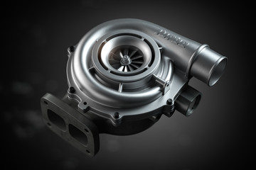 Car turbocharger on black background. Auto part turbo engine technology concept.