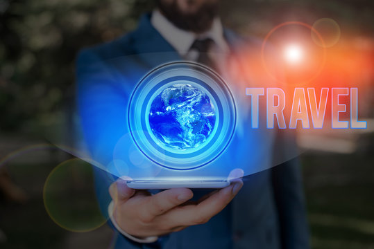 Conceptual hand writing showing Travel. Concept meaning the movement of showing between distant geographical locations Elements of this image furnished by NASA