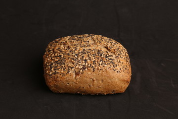delicious bread rolls on colored background