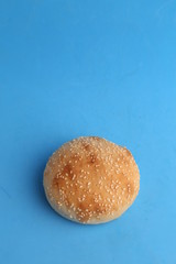 delicious bread rolls on colored background