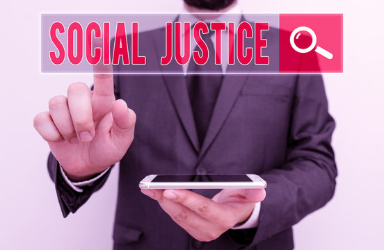 Writing note showing Social Justice. Business concept for Equal access to wealth and privileges within a society - Powered by Adobe