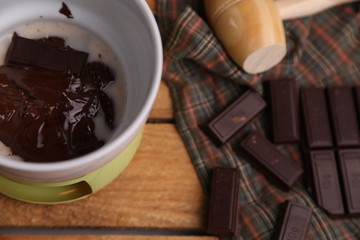 melting chocolate tablet in color background