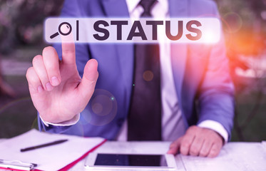 Handwriting text Status. Conceptual photo situation at a particular time during a process Professional position Businessman with pointing finger in front of him
