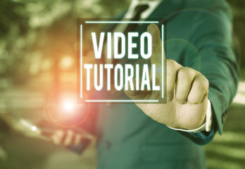 Handwriting text writing Video Tutorial. Conceptual photo method of transferring knowledge through audiovisual clips Businessman with pointing finger in front of him