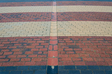 Interesting pattern of red black and beige bricks