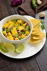 Homemade Mango Salsa with Ingredients and Corn Chips, vertical 