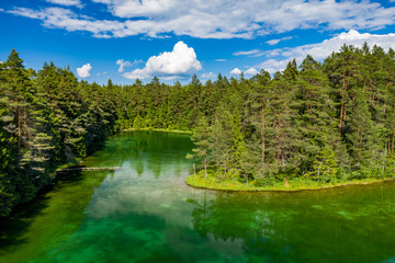Antu blue springs lake, Estonia, Europe. Artesian well, clean drinking groundwater erupting out of the ground. Pure clear water in natural environment