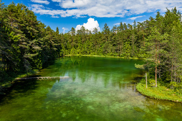 Antu blue springs lake, Estonia, Europe. Artesian well, clean drinking groundwater erupting out of...