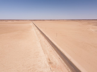 Aerial of desert road through arid landscape