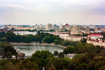 Minsk cityscape with Svislach river and General Staff of the Republic of Belarus in the distance. Aerial view on the center of Minsk, Belarus. City park surrounded by residential buildings
