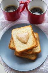 Delicious and healthy breakfast. Coffee, toast with peanut butter.