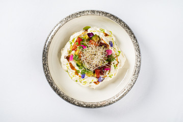 Stracciatella di bufala with avocado and fresh tomatoes