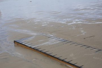 wooden bridge or walkway on the sandy beach of the sea