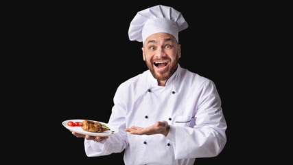 Cook Serving Chicken Dish Showing Plate On Black Background, Panorama