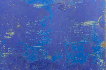 closeup of a peeled blue wall texture. top view