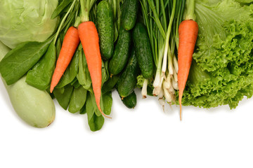 Fresh green vegetables and herbs isolated on white background. Space for text or design.