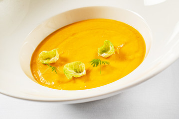 pumpkin cream soup in the white plate