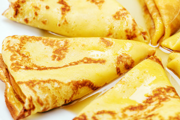 delicious pancakes on wooden table on the plate