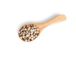 dried food with white pepper in wooden spoon isolated on white background.