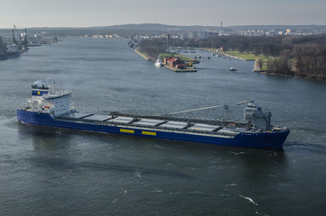 MARITIME TRANSPORT - The freighter maneuvers for mooring at seaport quay