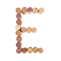 The letter "E" is made of wine corks. Isolated on white background