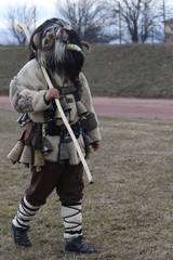 Elin Pelin, Bulgaria - February 15, 2020: Masquerade festival in Elin Pelin, Bulgaria. People with mask called Kukeri dance and perform to scare the evil spirits.